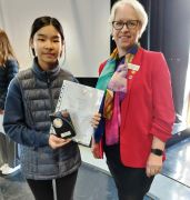 Francesca receives winners certificate from Rotary District 1045 Governor Annemarie van Bocheve Allen